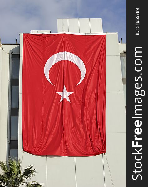 Giant Turkey flag on the building in Izmir. Giant Turkey flag on the building in Izmir