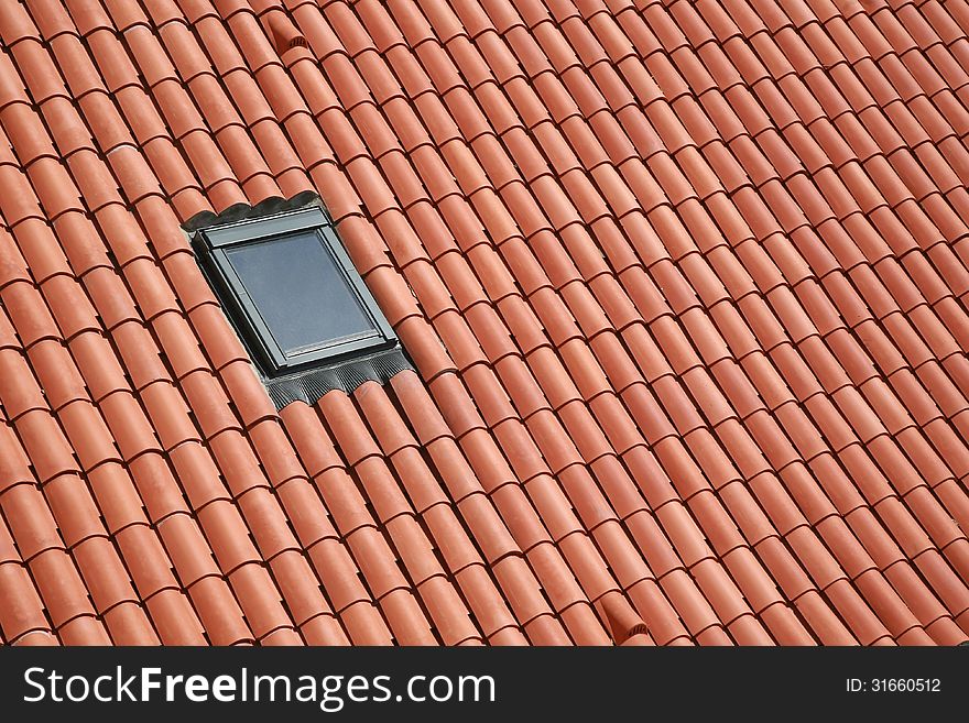 roof from red ceramic tiles with dormer