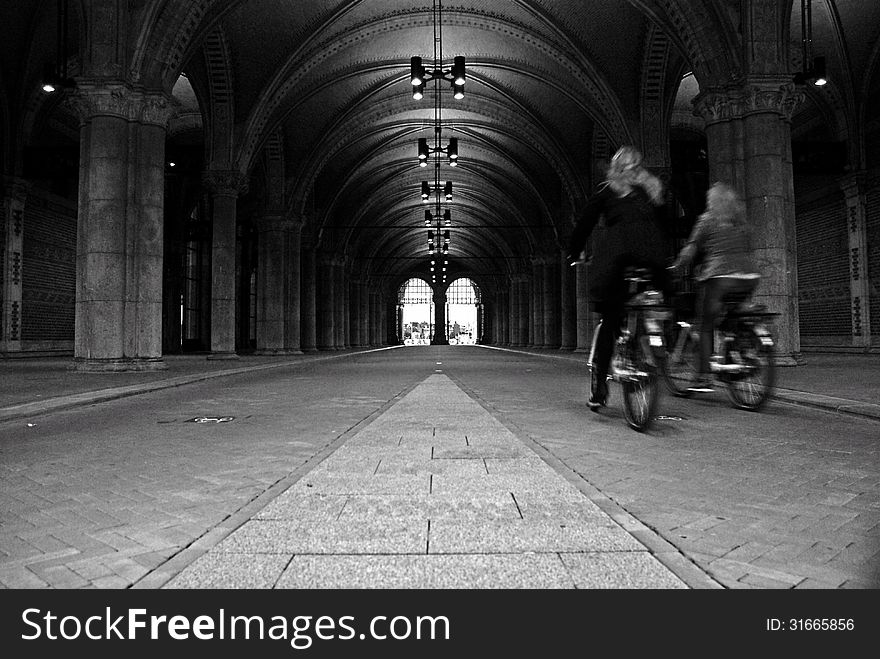 Cyclists at the public passageway of the Rijksmuseum, Amsterdam. Cyclists at the public passageway of the Rijksmuseum, Amsterdam