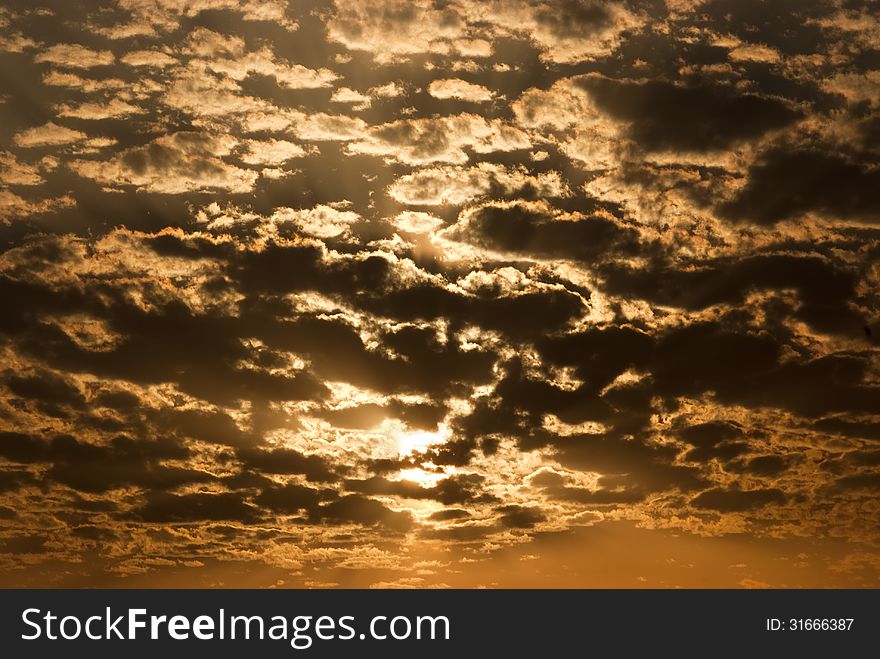 Golden waves of clouds during the sunset. Golden waves of clouds during the sunset
