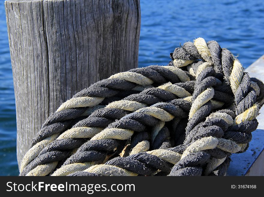 Thick knotted rope at the boat dock