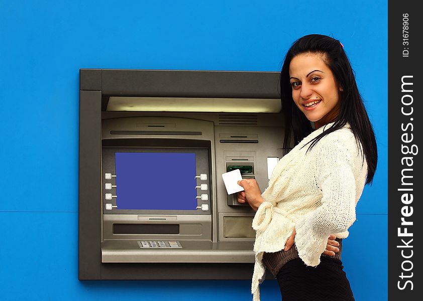 Woman withdraw money from atm