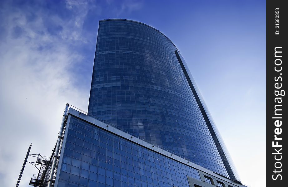 Exterior of the building in the city on a background of blue sky