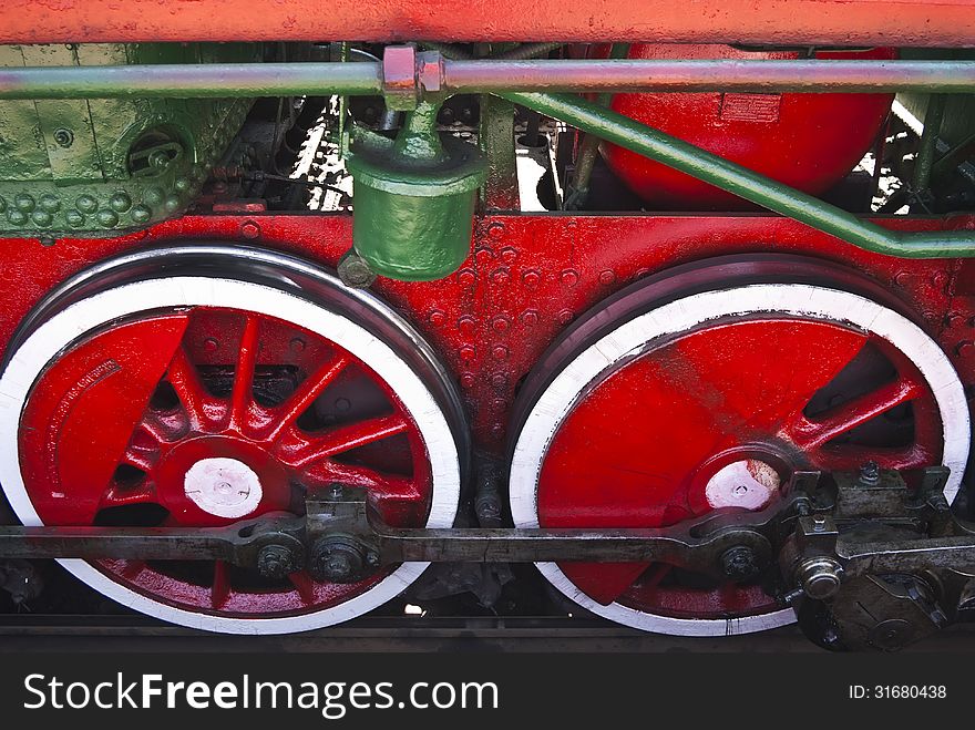 Wheels of the old steam locomotive close up