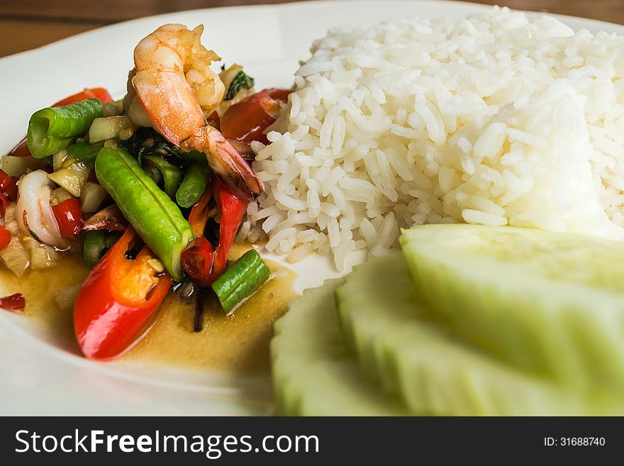 Stir fried sea food with basil leaf and steam rice. Stir fried sea food with basil leaf and steam rice