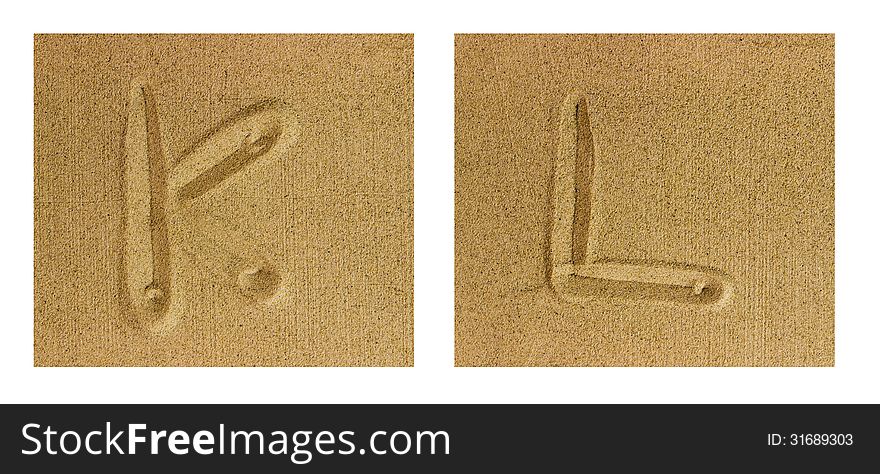 Alphabet letters hand written in sand on beach. Alphabet letters hand written in sand on beach