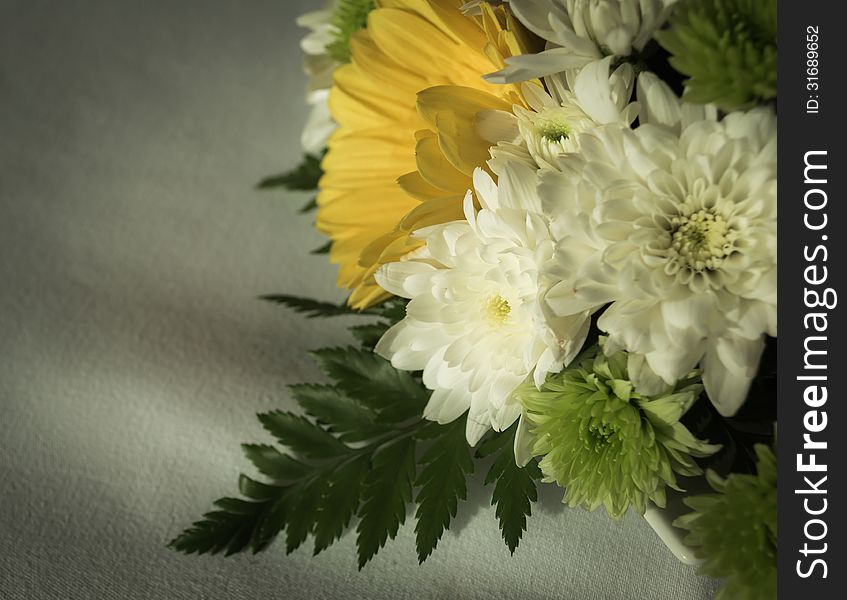 Bouquet of flowers on white color cloth