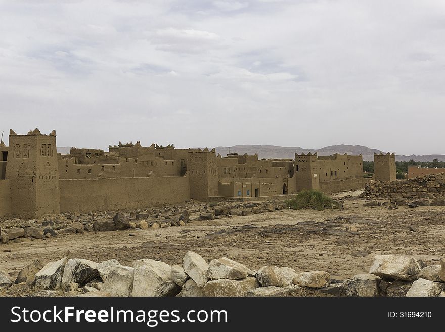 The way from Quarzazate to Zagora , over the mountains from the High Atlas in Morocco. Houses from a kasbah. The way from Quarzazate to Zagora , over the mountains from the High Atlas in Morocco. Houses from a kasbah.