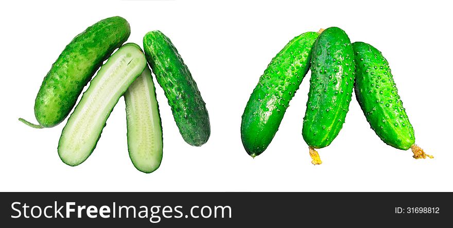 Two groups of cucumbers, three in each. The left group, one cucumber cut lengthwise into two parts. Objects isolated.