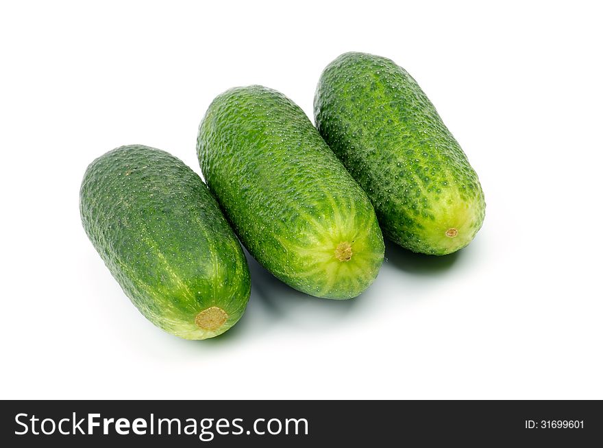 Three Raw Cucumbers In a Row  on white background