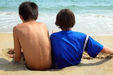 Two Boys-Sinking In The Sand Royalty Free Stock Image Two Boys-Sinking In The Sand Royalty Free Stock Image