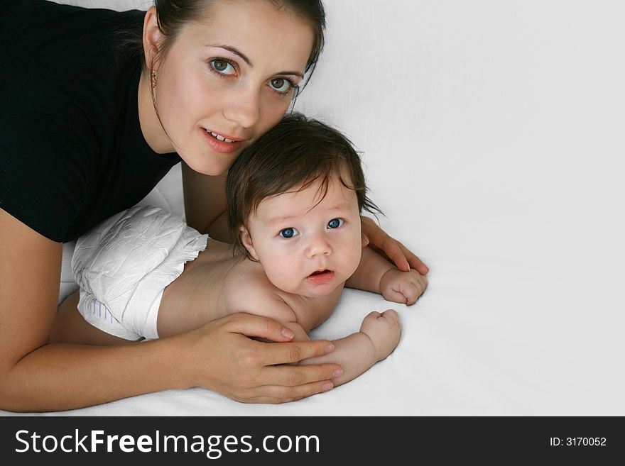 Tender young mother and happy child together. Tender young mother and happy child together