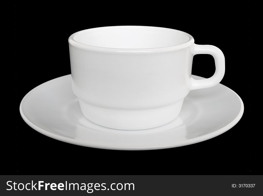 White cup and saucer, isolated on black background