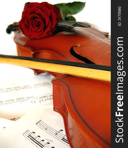 Violin and bow on music sheet. Violin and bow on music sheet