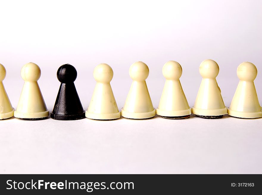 White and black pawns isolated on the white background