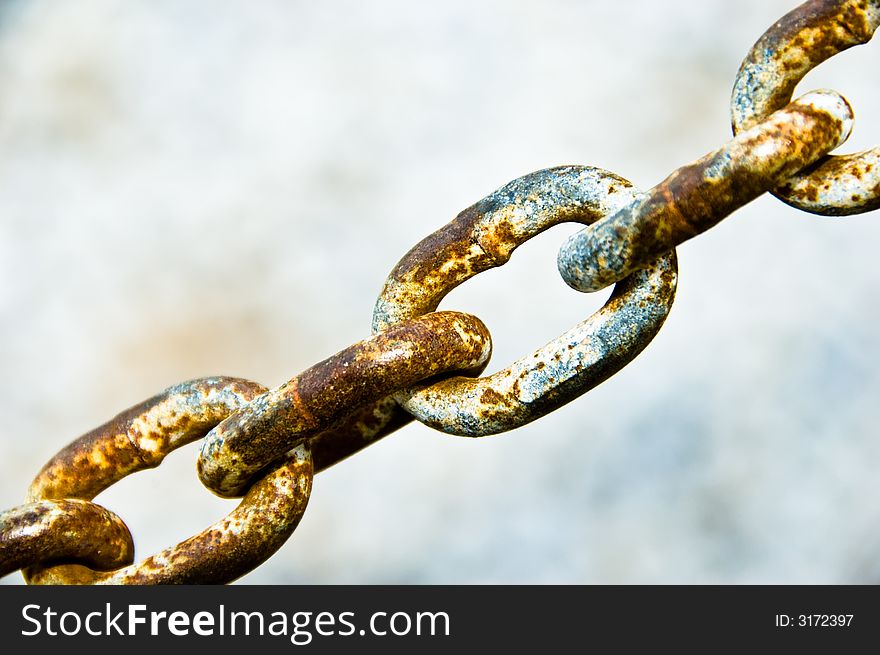 Rusty chain links on a light background