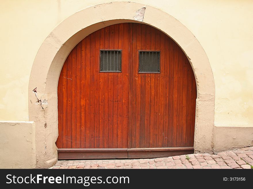 Rustic European Door with arch and cobblestone street. Rustic European Door with arch and cobblestone street