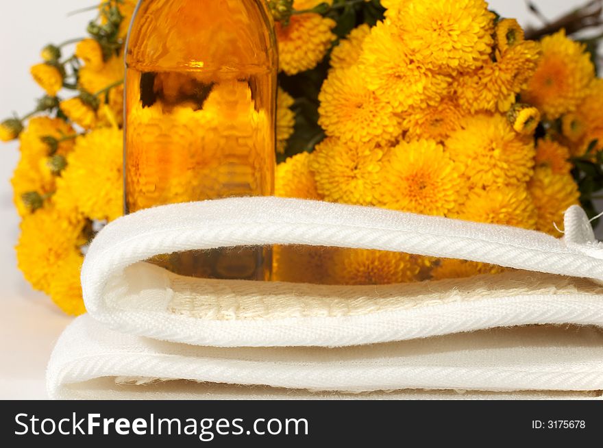 An image of oil and yellow flowers. An image of oil and yellow flowers