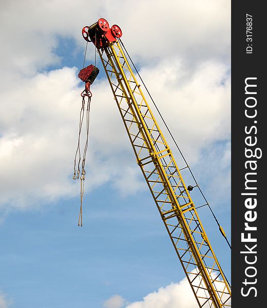 Lifting crane on a background of the sky