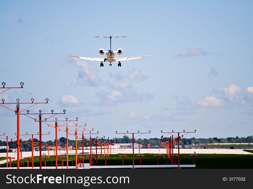 A large commercial jet landing at Cleveland Hopkins Airport.