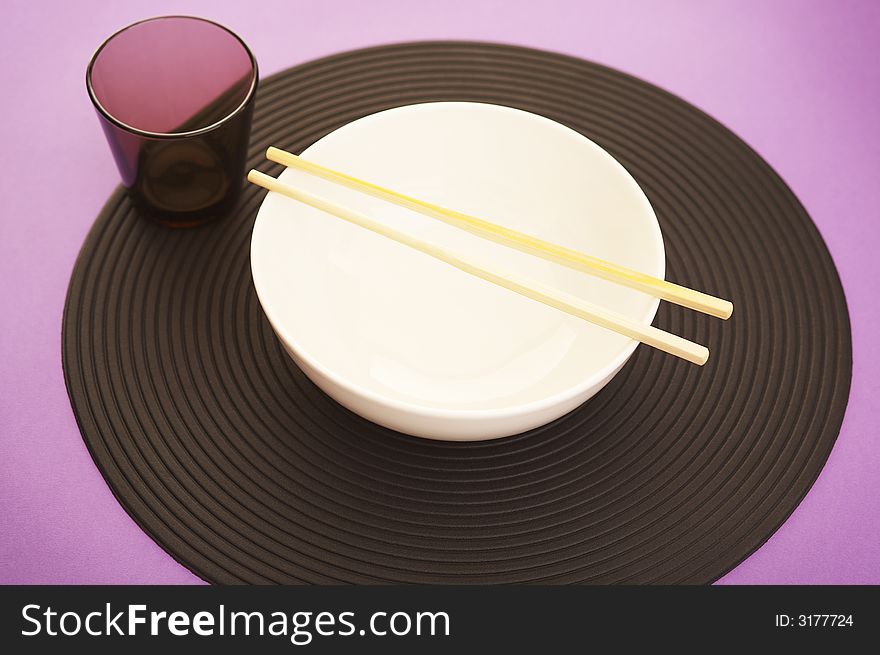 Empty rice bowl on the modern purple kitchen table