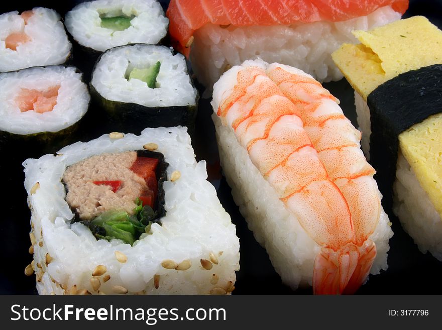 Close up shot of Sushi on a Black Background. Close up shot of Sushi on a Black Background