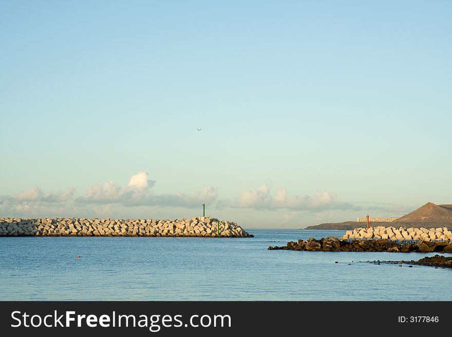 Breakwater protecting the entrance to a small harbour. Breakwater protecting the entrance to a small harbour