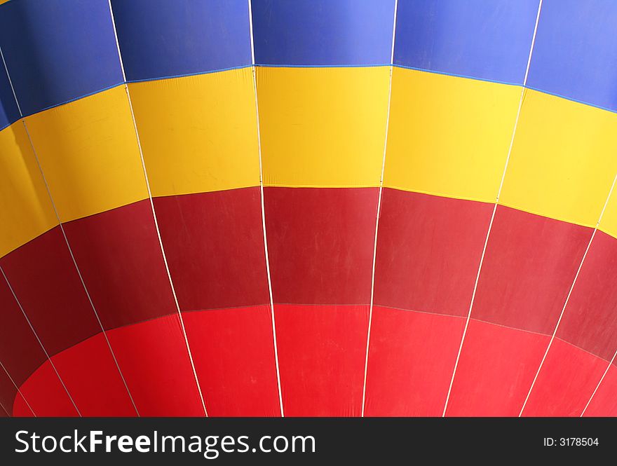 Colorful dirigible close-up with blue, yellow and red collors. Colorful dirigible close-up with blue, yellow and red collors