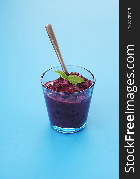 Glass of home made bilberry yogurt with bread crumbs