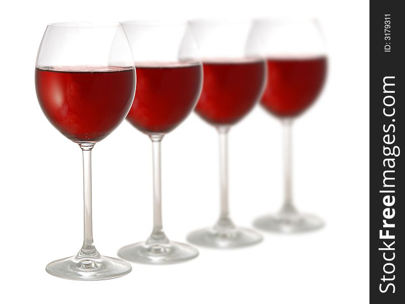 Four glasses of red wine isolated on white background