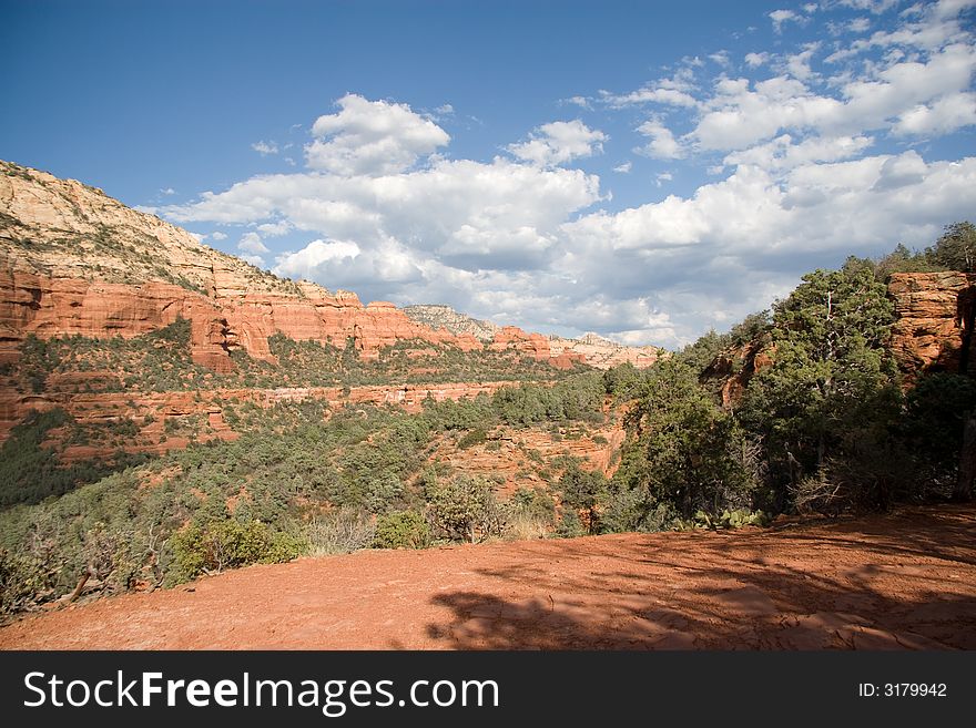 Every turn in Sedona contains yet another redrock canyon.  Shot from an overlook while ascending a mesa. Every turn in Sedona contains yet another redrock canyon.  Shot from an overlook while ascending a mesa.