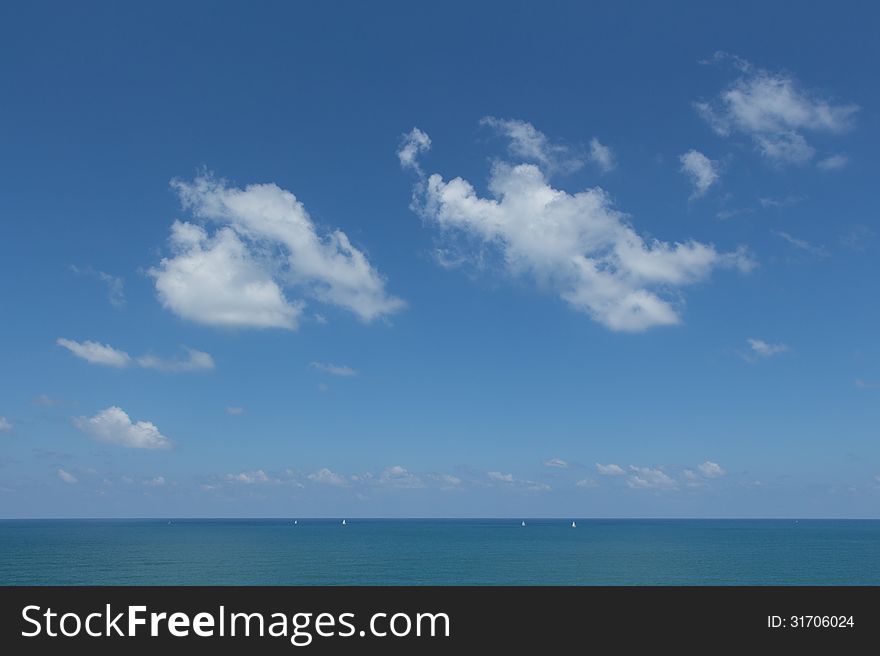 The blue sea under a blue sky.