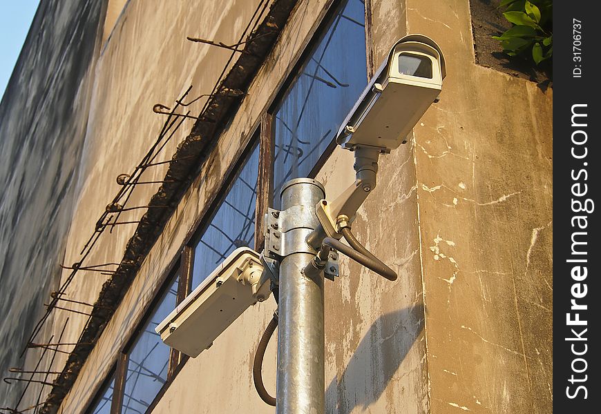 Surveillance cam on building background for security. Surveillance cam on building background for security