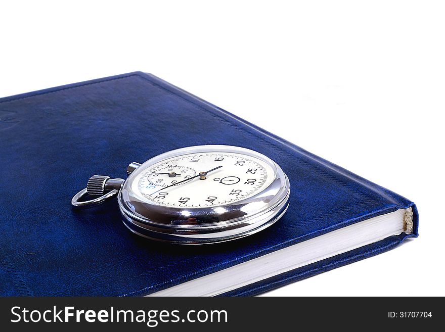 Stopwatch And The Notebook On A White Background