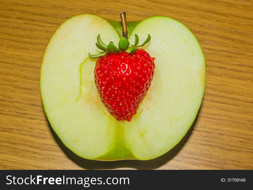 Combination of an apple and a strawberry. Combination of an apple and a strawberry