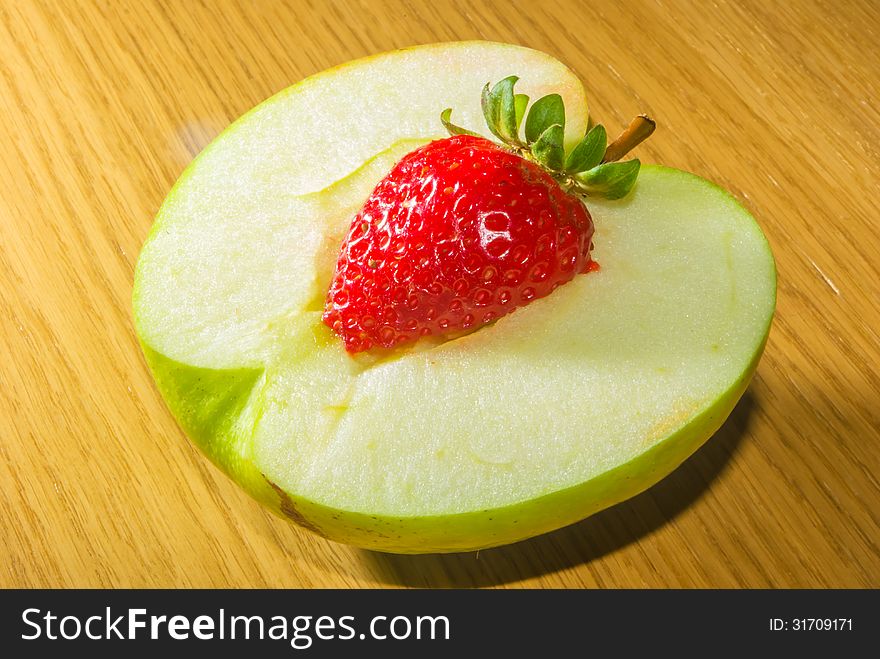 Combination of an apple and a strawberry. Combination of an apple and a strawberry
