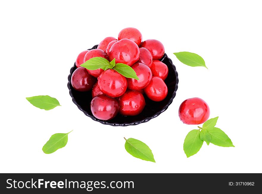 Sweet cherries in a plate isolated on white