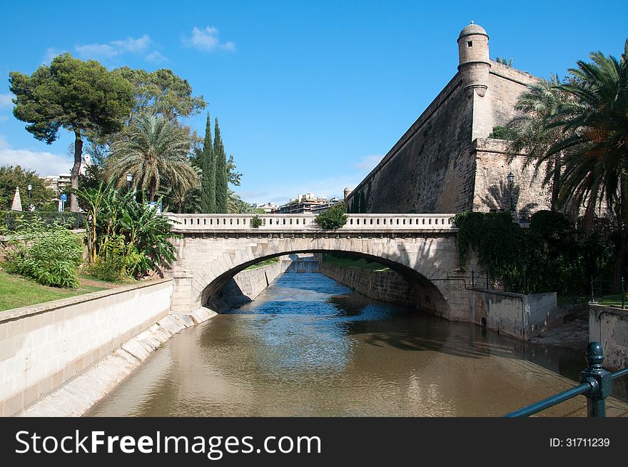 Canal Torrent de Sa Riera and medieval building containing the Museum of Contemporary Art Es Baluard in Palma de Mallorca, Spain. Canal Torrent de Sa Riera and medieval building containing the Museum of Contemporary Art Es Baluard in Palma de Mallorca, Spain.