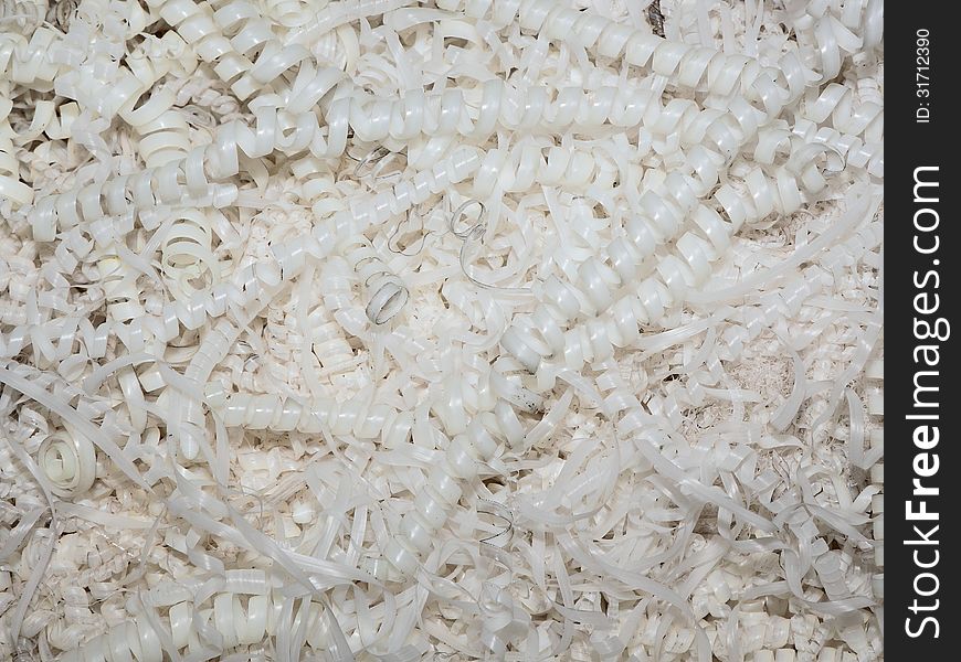 A pile of shavings from the polymer making up about the machine tool. A pile of shavings from the polymer making up about the machine tool