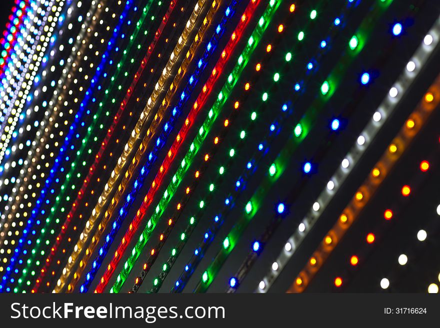 Detail of a flexible color ropes lights switched on in the dark. Detail of a flexible color ropes lights switched on in the dark