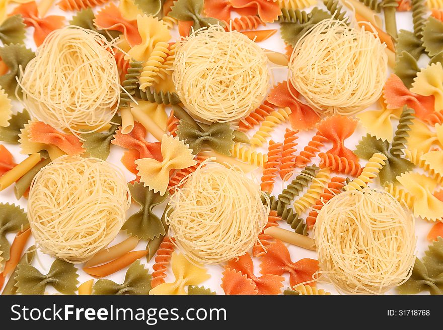 A different pasta in three colors on the white background. A different pasta in three colors on the white background.