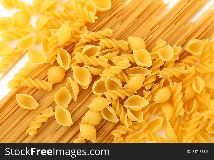A different pasta are located on the antire background. A different pasta are located on the antire background