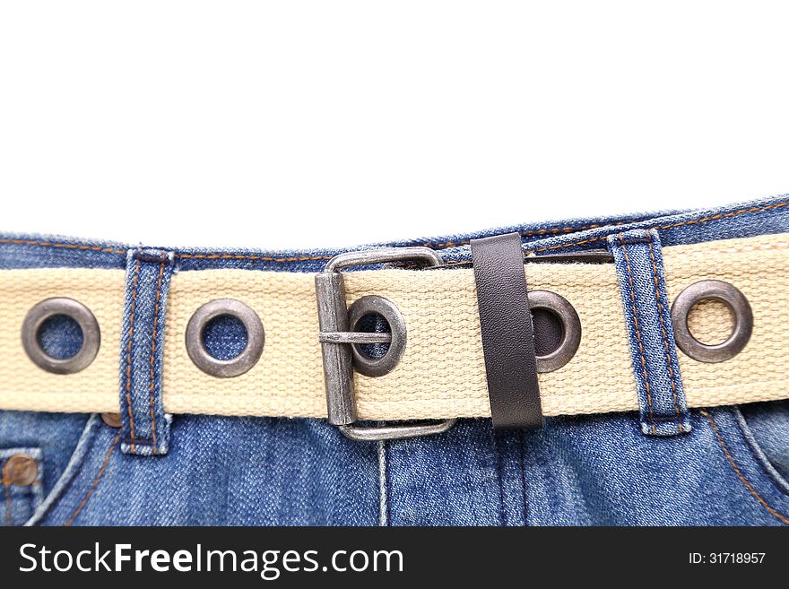 Blue jeans and leather white belt on the white background