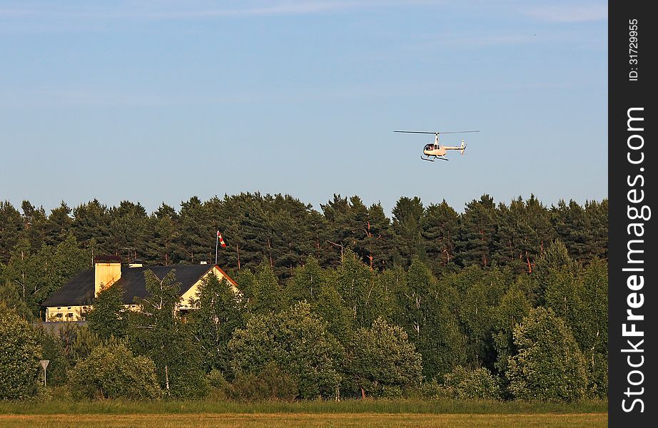 Landing personal helicopter on the private site of country house. Landing personal helicopter on the private site of country house