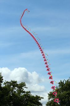 String Of Kites Joined Together Flying. Stock Photos