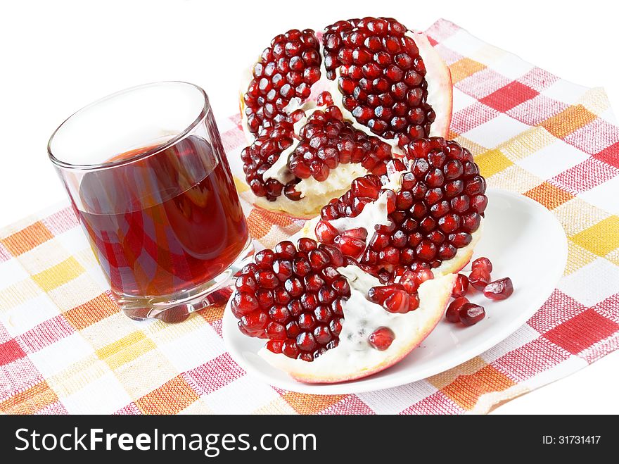 Pomegranate juice in a glass and a pomegranate