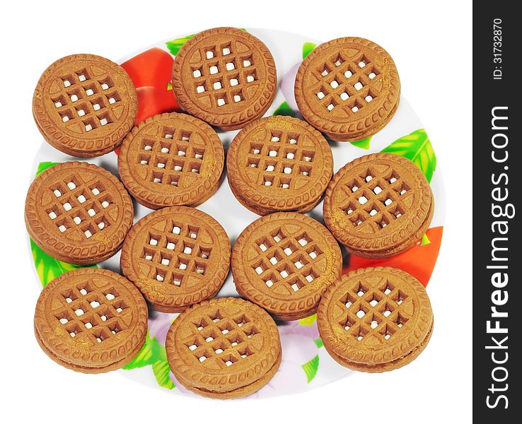 Round cookies on the plate isolated on white