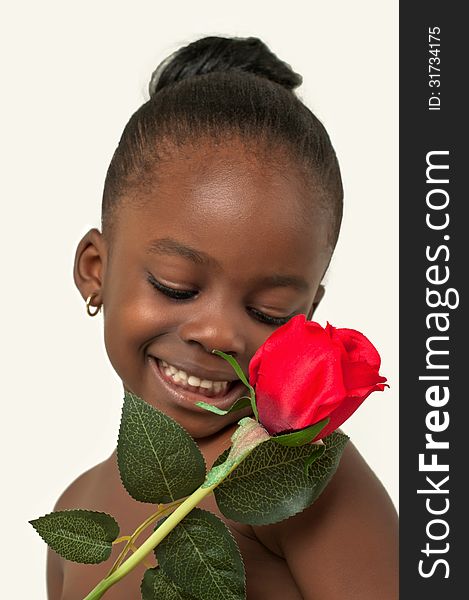 Beautiful African American little girl with red rose over white background. Beautiful African American little girl with red rose over white background