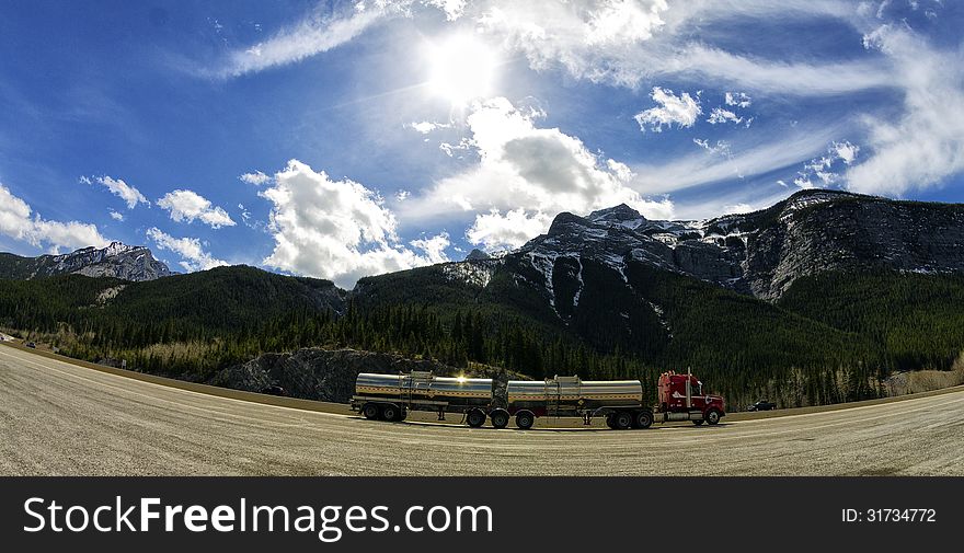 Double tanker truck driving thru the rockies. Double tanker truck driving thru the rockies