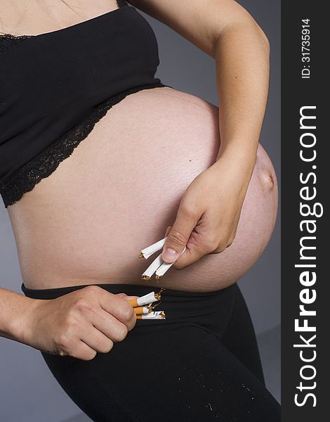 Pregnant Woman Expecting Baby Breaks Tabacco Cigarettes No Smoki